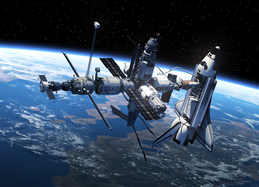 Space Shuttle And Space Station In Space. 3D Scene.